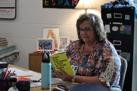 Spanish teacher Laura Alldredge read “Don't give the enemy a seat at your table" by Louie Giglio. The book discusses not allowing negative thoughts like fear, insecurity, and anxiety to get into one’s mind. 