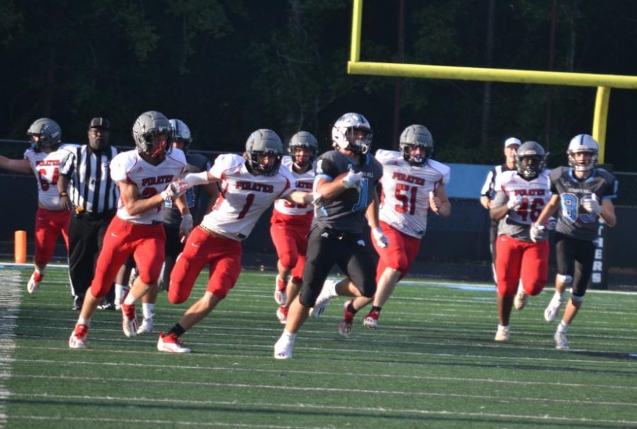 Pike County Pirate defense chases down Panther running back Josh Layton. The Panthers run game dominated Pike while the defense kept Pike scoreless through three quarters in a dominant 30-15 victory.  