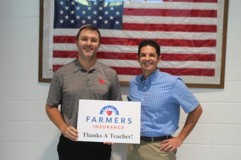 This month’s Golden Apple teacher J.B. Campbell pictured with Tim Monihan from Farmers Insurance. English teacher Brandon Kendall selected Cambell for his teaching skills and his dedication to his students.