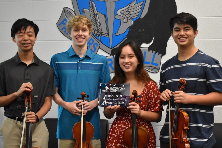 Quartet Le Petit members pose with the Franklin Pond Chamber Music Competition School Prize. The quartet also earned second place overall for performing Beethovens “String Quartet No. 4 Op. 18.”