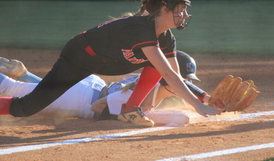 Senior pitcher Lili Backes safely slides to avoid the tag. “It was great to see us be able to answer back in that second game and get runs,” Backes said.