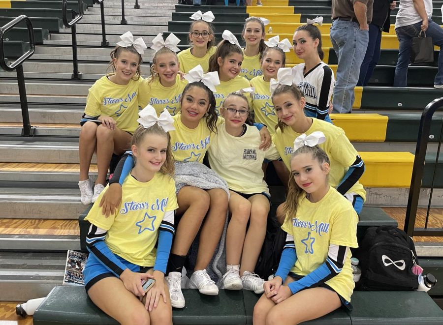 JV cheer gathers after competing at Ola High School. The team placed second behind Greenbrier. 