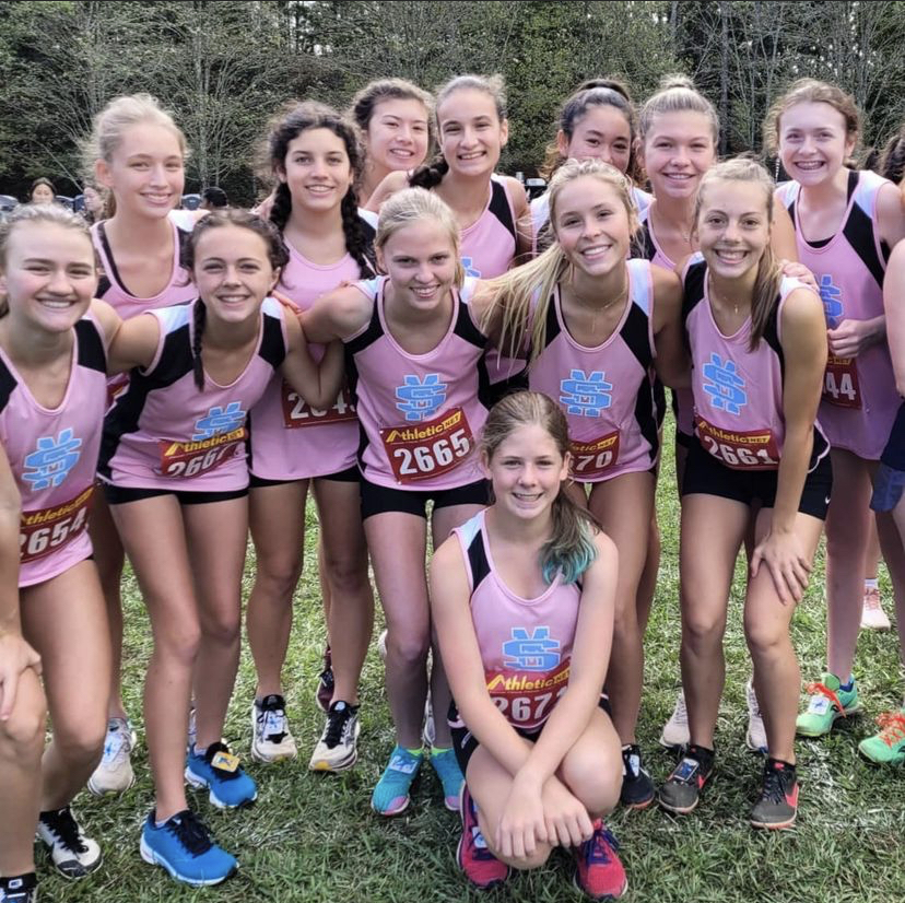 Varsity girls pose at the Coach Wood Invitational race. They placed 5th overall. 