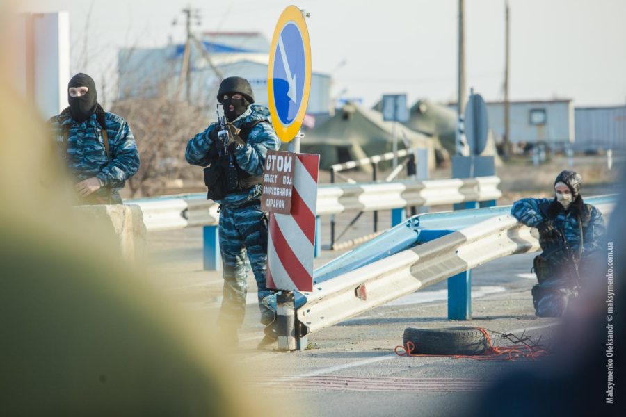 Ukrainian military stands guard at a border checkpoint. The increasing tension in the region is prompting debate over how the United States should act. 