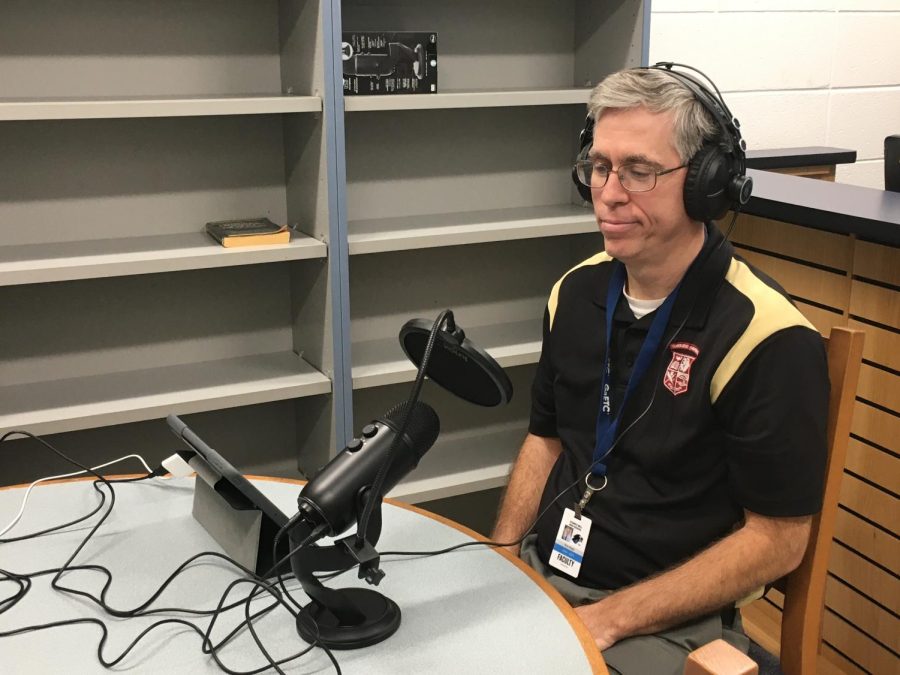 Media specialist Rick Wright sits and records the Ex Libris Book Club Teasers podcast. The podcast is just one of many projects Wright is doing to encourage students to read. 