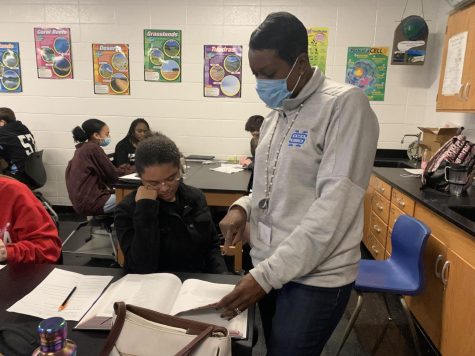 Paraprofessional Stephanie Williams assists a student in Chris Kesterson’s environmental science class. Williams previously worked at Oak Grove Elementary School for two years before moving to Starr’s Mill.