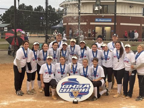 Starr’s Mill softball team poses with the GHSA championship trophy after defeating Northside-Columbus 9-0 in five innings. The Lady Panthers used their team motto of “less” to lead them through the playoffs, not losing a single game en route to capturing the first softball state title in school history.