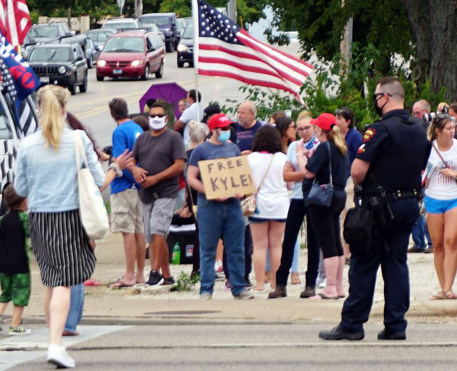 Individual holds a sign in support of Kyle Rittenhouse. Rittenhouse, who received a verdict of not guilty, is proving the importance of the Second Amendment. 