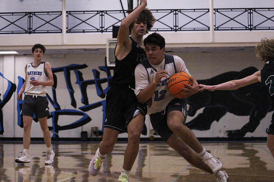 Logan Inagawa fights to bring the ball across the court. McIntosh defeated Starr’s Mill in a fast-paced, aggressive game.