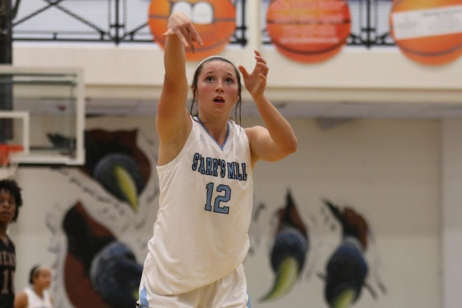 Sophomore Sunny McQuade attempts a free throw. With the final shot to tie the Lady Panthers and the undefeated Heard County Braves, McQuade launched the game into overtime. Starr’s Mill lost 45-42 in a tense, close battle to the finish.