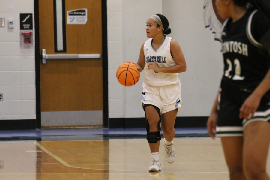 Senior Carrie Consolino brings the ball up the court. In their second region game of the season, Starr’s Mill lost to the McIntosh Chiefs 43-29 despite attempts to push back against the Chief defense.