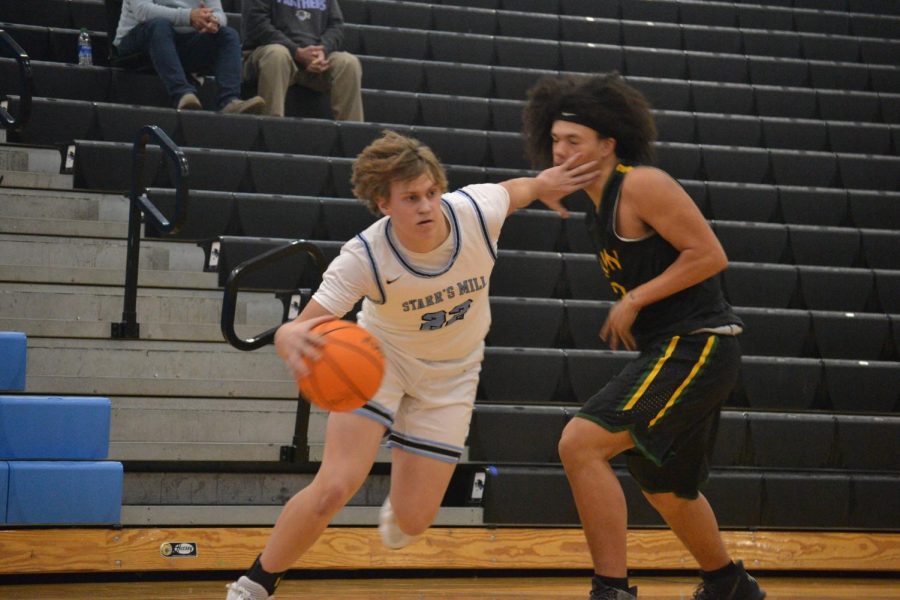 Sophomore Pete West drives past a Griffin defender. An unrelenting offensive attack combined with stifling defense proved to be an unexpected slap in the face for Griffin.