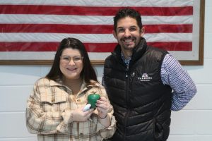 This month’s Golden Apple teacher Lauren Kuykendall pictured with Tim Monihan from Farmers Insurance. Economics teacher Walt Ellison chose her for her dedication to her students and family-like atmosphere in the classroom.