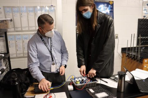 January 19, 2022 - STAR Student William Van Huffel and physics teacher Nick Gillies work on a lab during AP Physics II. Van Huffel is an avid student of science who has been supported by Gillies in the subject.