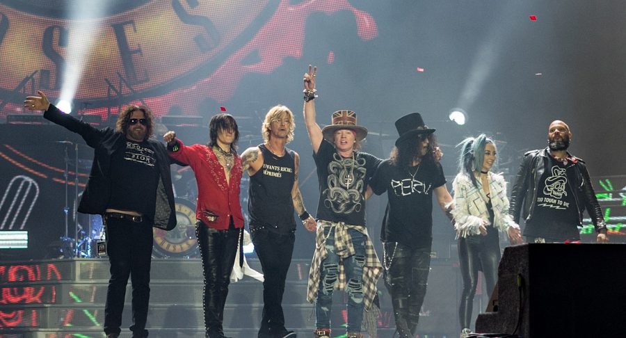 All members of Guns N’ Roses stand on stage after a concert. Most known for “Sweet Child O’ Mine,” the band is known for their distinct style of aggressive rock-and-roll.
