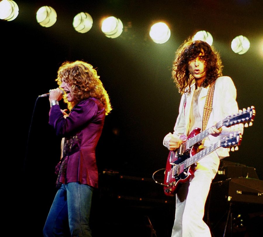 Lead+singer+Robert+Plant+and+lead+guitarist+Jimmy+Page+stand+on+stage.+As+one+of+the+most+influential+bands+in+rock-and-roll+history%2C+Led+Zeppelin+has+changed+the+course+of+music+since+their+debut+in+the+%E2%80%9860s.