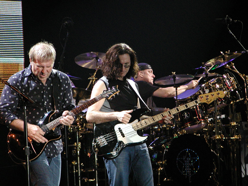 Guitarist Alex Lifeson and bass player and frontman Geddy Lee stand on stage during a concert. Lee’s distinctive nasally and clean vocals make Rush what it is - the essence of progressive rock.