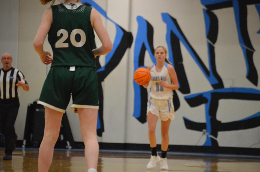 Freshman Gabby Roach dribbles the ball up the court. Roach was a big part of this basketball season for the Panthers, often leading the team in scoring.