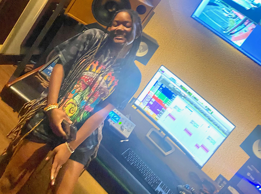 Senior+Christine+Jackson+sits+in+the+studio.+Late+last+year%2C+Jackson+released+her+new+song+%E2%80%9CMoney+Showers%E2%80%9D+on+Soundcloud.+As+her+first+professionally+released+song%2C+%E2%80%9CMoney+Showers%E2%80%9D+was+inspired+by+many+artists+like+Travis+Scott+and+Jack+Harlow.