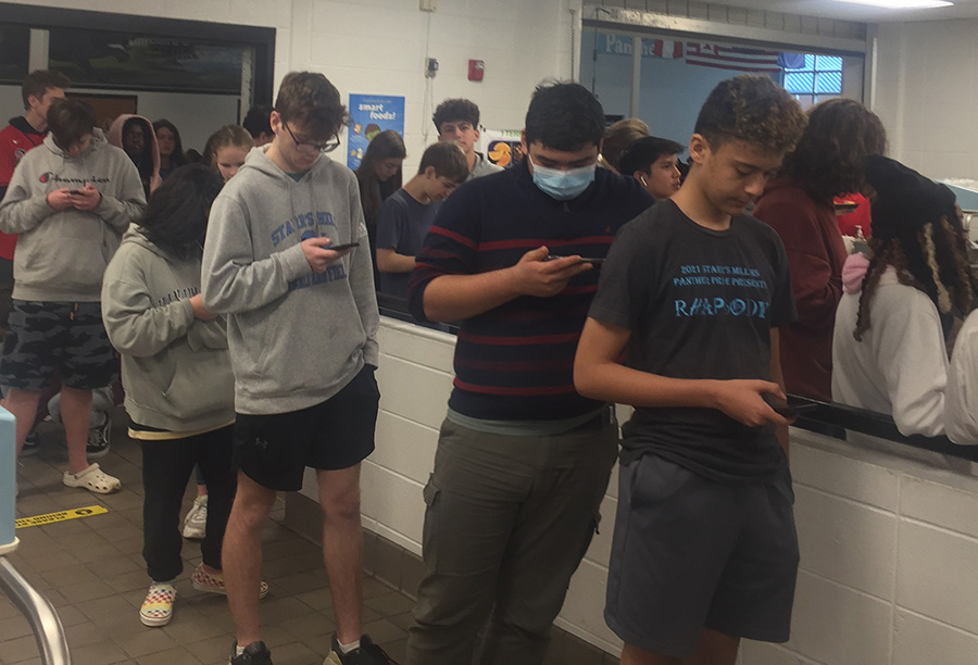 Students wait in the lunch line which overflows out into the main cafeteria. Long lunch lines have been a consistent issue, and students are fed up. 