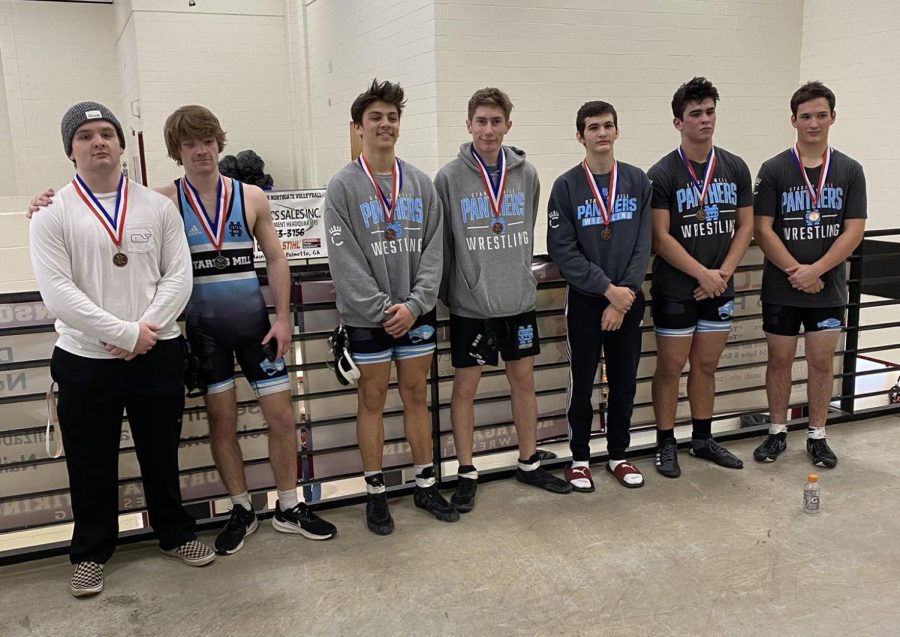 Qualifiers for the sectional traditional meet pose with their medals. Seven of 11 Starr’s Mill wrestlers advanced to compete at LakePoint this weekend. 