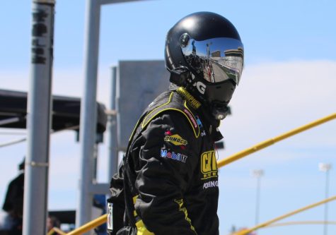 Pit crew member for Grant Enfinger waits for a pit stop to begin. Enfinger, driver of the No. 23 Champion Power Equipment Chevrolet, finished eighth in the race and is currently 16th in Camping World Truck Series points.