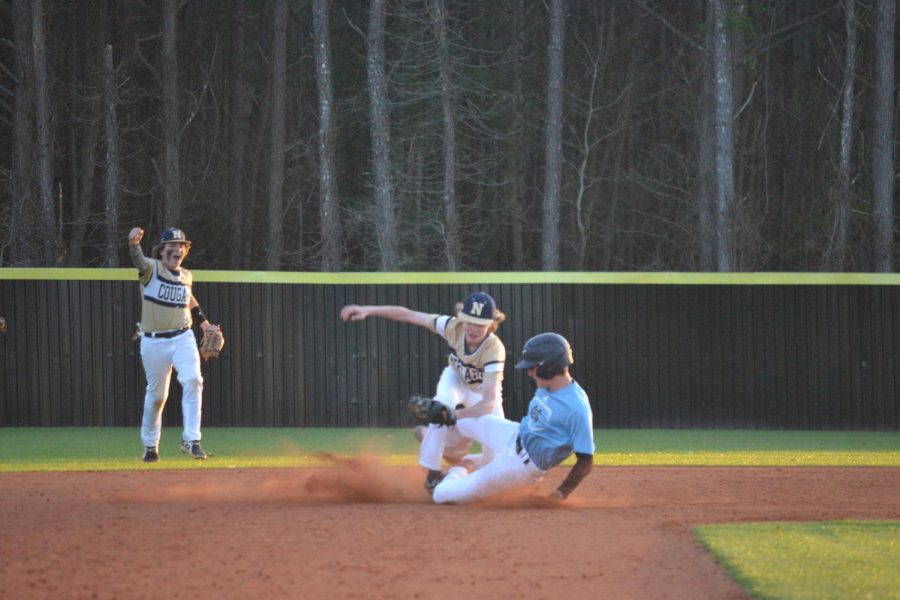 Panther+player+called+out+at+second+as+Newnan+players+celebrate.+The+Panthers+inability+to+drive+in+runs+was+the+leading+factor+in+the+5-4+loss+to+Newnan.+