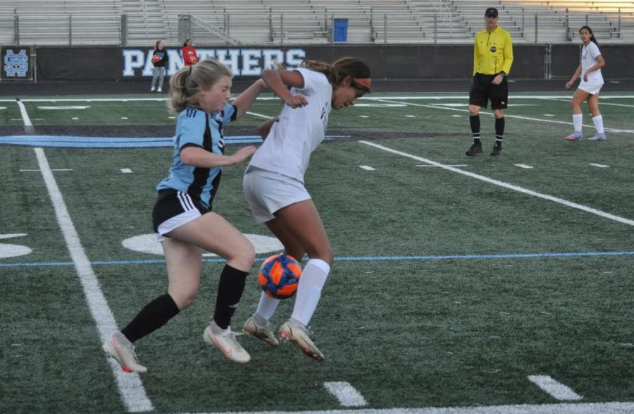 Two players fight over possession of the ball. Possession was back and forth through most of the game, with Starr’s Mill coming out on top to begin region play with a victory.