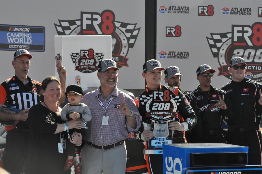 Corey Heim poses in Victory Lane after earning his first career Camping World Truck Series win on a last-lap pass. Heim, driver of the No. 51 JBL Toyota for Kyle Busch Motorsports, grew up in Marietta, Georgia. 