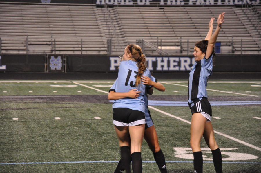 Lady Panthers hug in celebration after winning their first region game of the season, defeating Northgate 5-2. Sophomore Mia Hargrove (15) scored three of the team’s five goals. 