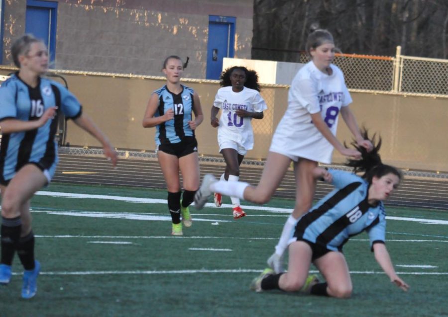 Freshman Isabella Large (18) falls in front of a Lady Indian opponent. The Lady Panthers could not overcome the pressure from East Coweta, losing 4-0.