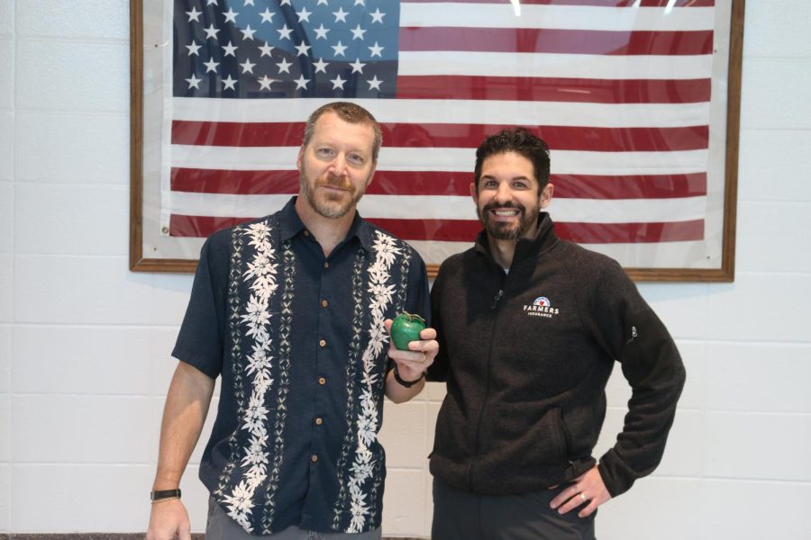 This month’s Golden Apple teacher Todd Little pictured with Tim Monihan from Farmers Insurance. Learning specialist Laura Harbin chose Little for his dedication to the success of his students and innovative teaching methods. 