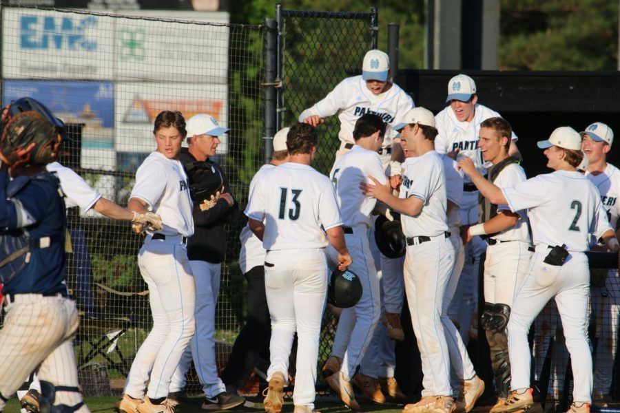 Sophomore Austin Sellers (5) celebrates with teammates after a three-run homerun in the bottom of the third inning. After a single by senior first baseman Alex Ukleja (14), the Starr’s Mill Panthers won 9-8 against Northside-Columbus, the team’s second-straight walk-off win. 