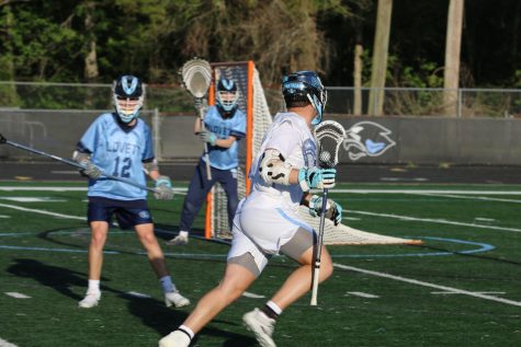 Senior Barrett Schmidlkofer heads toward Lovett’s goal. The Panthers played undefeated opponent Lovett in last Friday’s home game and lost 11-9.