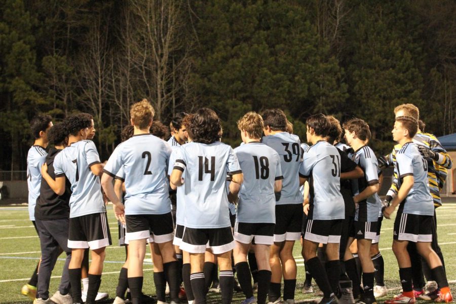 Varsity boys huddle before the match against McIntosh. With a 2-1 win, the Chiefs also earned the top spot in Region 2-AAAAA.