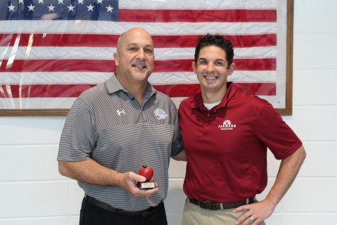 April’s Golden Apple teacher Mark Williamson pictured with Tim Monihan from Farmers Insurance. Special needs teacher Cindy Hartpence chose Williamson for his commitment to helping students succeed. 