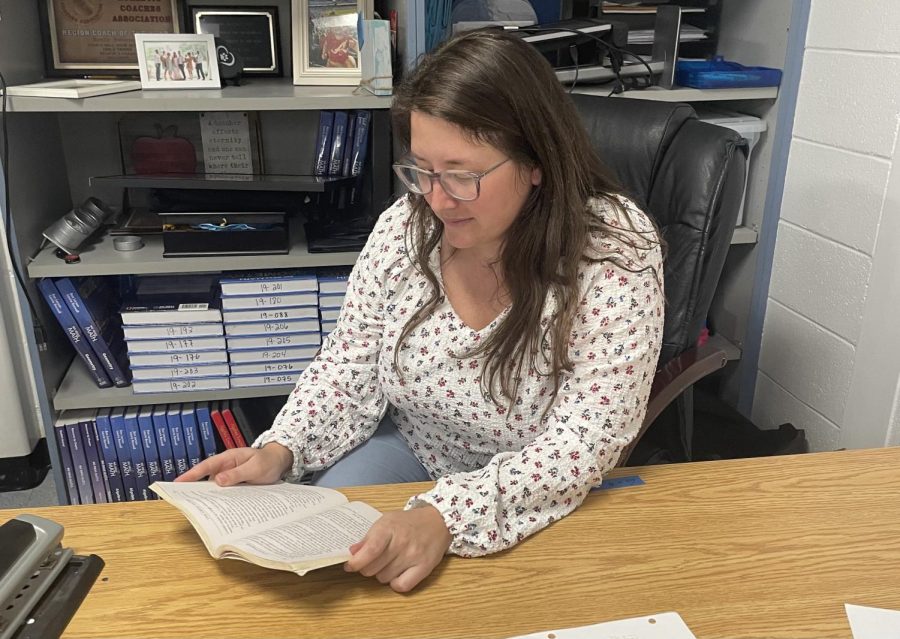 Math teacher Emily Sweeney enjoys reading the book “Redeeming Love” by Francine Rivers. The book follows the journey of a young girl in the 1850s and her hopes of finding love. 