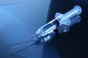 Medical needle lays on a table. Discussion of whether or not euthanasia should be used in order to treat patients has been a topic of debate for years. 