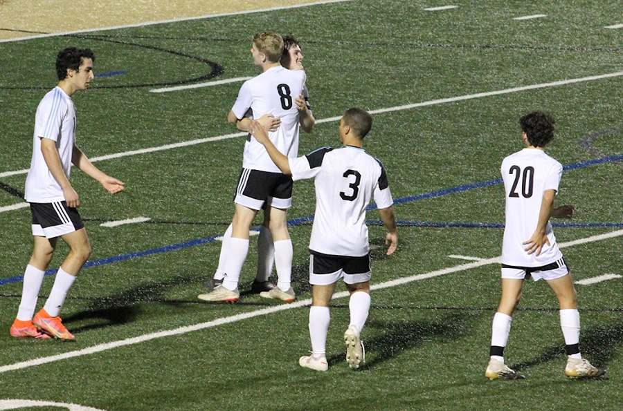 Senior Casper-Krabsen Jensen hugs fellow senior Josh Sims after Sims scored in the second half, extending the Starr’s Mill lead. The Panthers defeated the Ola Mustangs 6-1 to advance to the second round of the GHSA state playoffs.