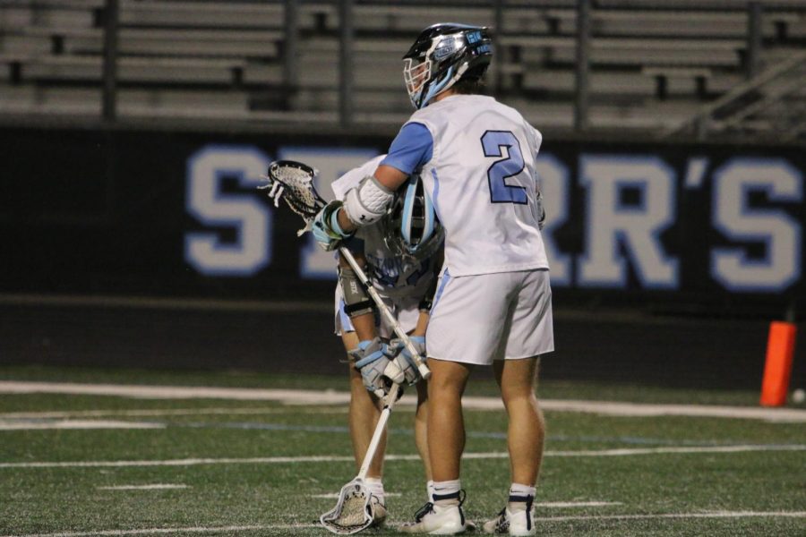 Sophomore Andersen Cardoza comforts teammate senior Bennett Via after losing 11-6 in the state semifinals. This was the first time Starr’s Mill boys lacrosse had advanced to the final four. 