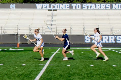 Senior Emma Grace Hepler carries the ball into the attacking third of the field while avoiding a Northview defender. Hepler combined for five goals, two assists, and seven draw controls. Hepler finished as the leader in points for the Panthers this season. 