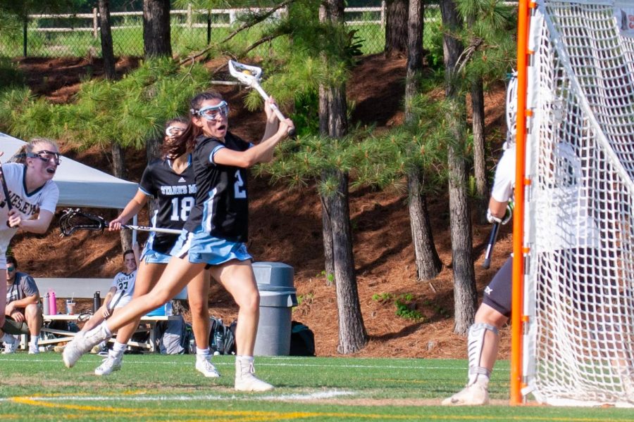 Senior Hannah Leon flashes down the middle of the offensive end in the Panthers second round matchup against Wesleyan last night. Leon contributed six of the 19 goals during the game. She notched the most important goal of the night in OT lifting the Panthers to the quarterfinals. 