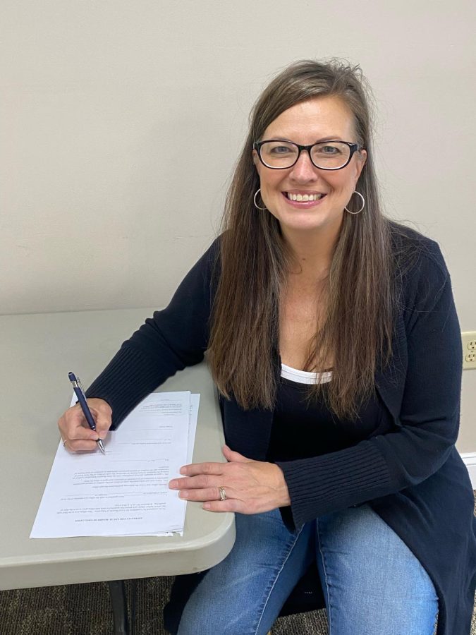 Alyson Otto poses with an affidavit for the local board of education. Otto is running for a seat on the board of education in the impending May 24 primary election. 