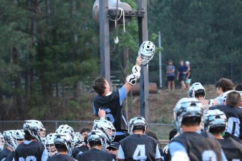 Senior Barrett Schmidlkofer rings the victory bell to signify the team’s win against the Woodward War Eagles. Starrs Mill made history with the 8-2 win, sending the team to the state semifinals for the first time in school history.