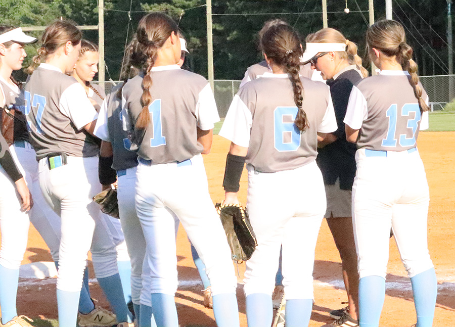 Head+coach+Peyton+Dean+gathers+with+the+varsity+softball+team+prior+to+the+team%E2%80%99s+first+region+game+against+Troup+County.+Coming+off+of+the+team%E2%80%99s+first+championship+in+program+history+has+provided+new+challenges+and+new+opportunities+for+the+Panthers.