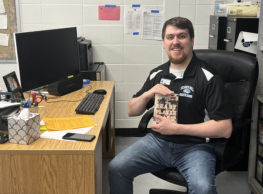 English teacher Terence Fitzgerald is currently reading “Ready Player Two” by Ernest Cline. The novel follows Wayde Wyatt’s adventure in facing obstacles to save his futuristic world.  