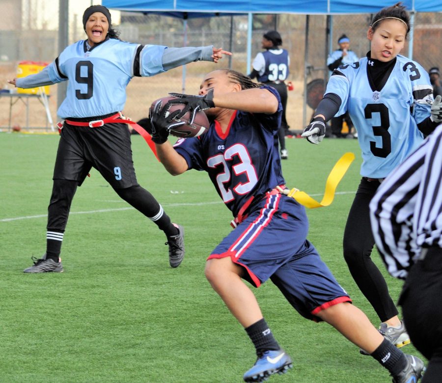 Flag football player avoids an opponent trying to snag her flag. Starr’s Mill is adding a flag football team and a gymnastics team to its slate of GHSA-sponsored sports.