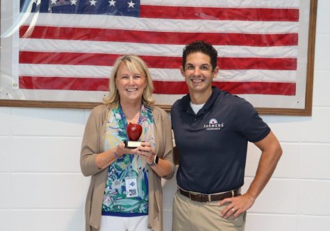 LEA and special education department chair Diane Kurbes stands alongside Tim Monihan from Farmers Insurance. Math teacher Dr. Nick Castagna chose Kurbes for how hard she works on a daily basis and the many roles she plays at Starr’s Mill.