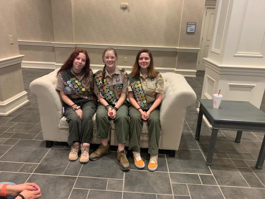 Adeline Harper sits with troop members Hailey Pecoraro and Jasmine Pecoraro. The three had their Eagle Board of Review meetings at the same time, and became Eagle Scouts together.