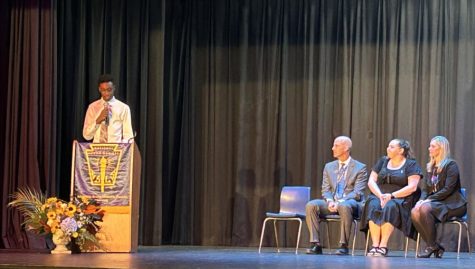 National Honor Society president Tito Alofe addresses the crowd at last night’s induction ceremony. NHS welcomed 102 new members this year. 